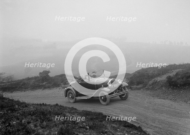 Kitty Brunell driving a 1930 2-seater Ford Model A, 1931.   Artist: Bill Brunell.