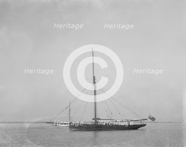 The cutter 'Cymberline' under way by motor. Creator: Kirk & Sons of Cowes.