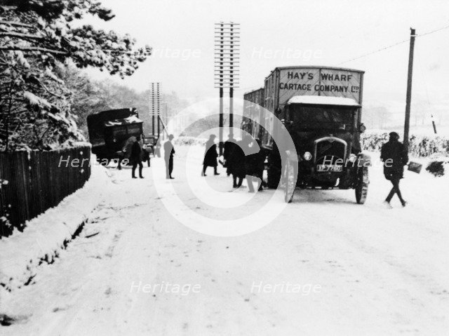 A Hay's Wharf Cartage Company Ltd van along a snowy A30, near Basingstoke, Hampshire, 1920s. Artist: Unknown