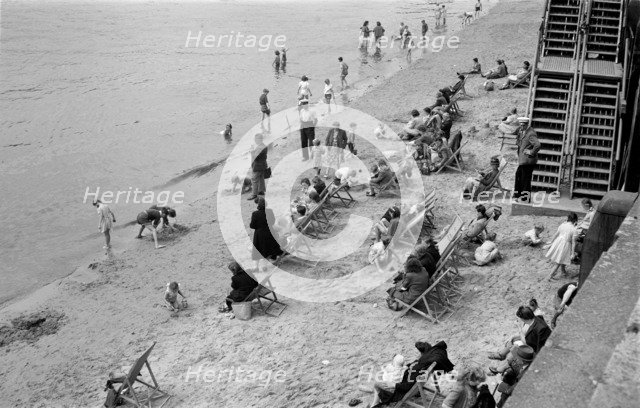 People relaxing on Tower Beach, London, c1945-c1955. Artist: SW Rawlings