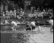 People in Sinking Rowing Boat, Watched by Crowd, 1933. Creator: British Pathe Ltd.