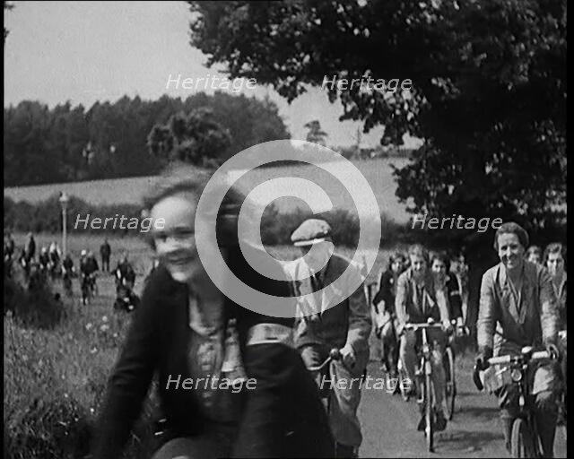 Large Group of Civilians Riding Bicycles Through Country Lanes, 1931. Creator: British Pathe Ltd.