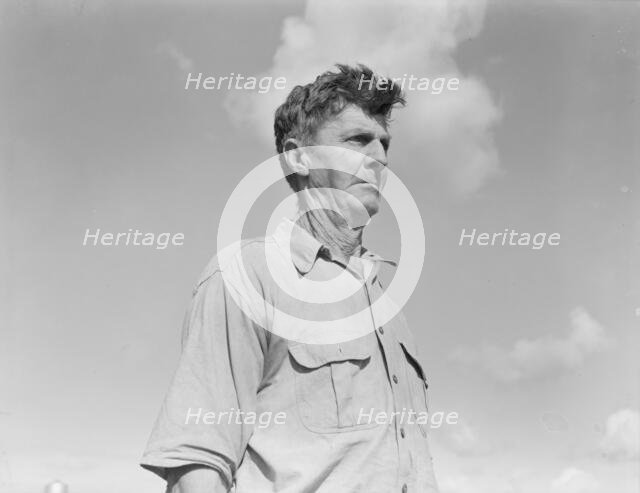 Industrialized agriculture, from Texas farmer to migratory worker in California, Kern County, 1938. Creator: Dorothea Lange.