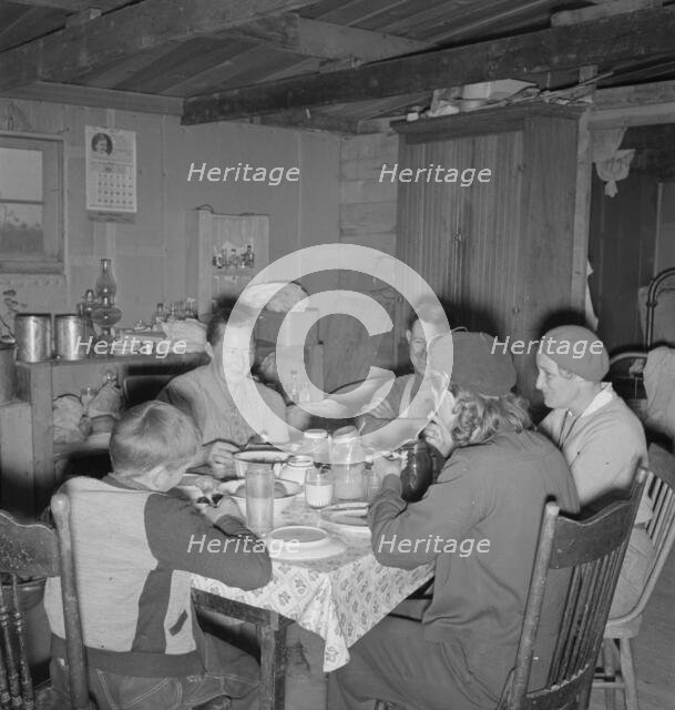 The Wardlow family in their dugout basement home, Dead Ox Flat, Malheur County, Oregon, 1939. Creator: Dorothea Lange.