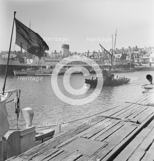 A view of the harbour at Weymouth showing various vessels including SS St Julien, 1948. Creator: John Laing plc.