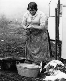 Gypsy woman washing clothes, 1960s.