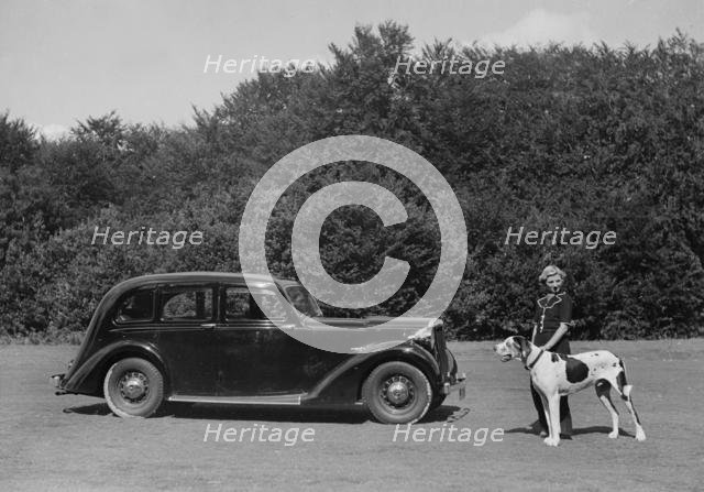 1938 Daimler DB18 with lady and her pet dog. Creator: Unknown.