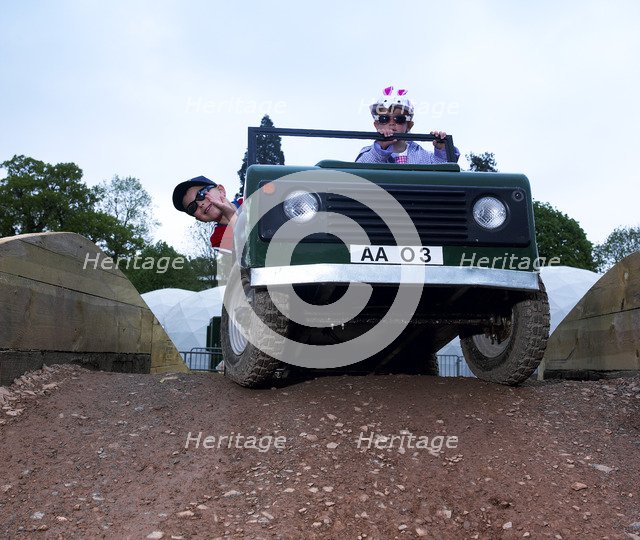 Child driving a toy Land Rover. Artist: Unknown.