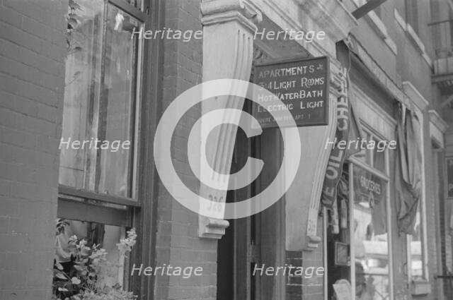 A sign offering apartments for rent, 61st Street between 1st and 3rd Avenues, New York, 1938. Creator: Walker Evans.