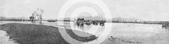 'Sur la route de Monastir; une route inondee dans la plaine au Sud de Kenali', 1916. Creator: Unknown.