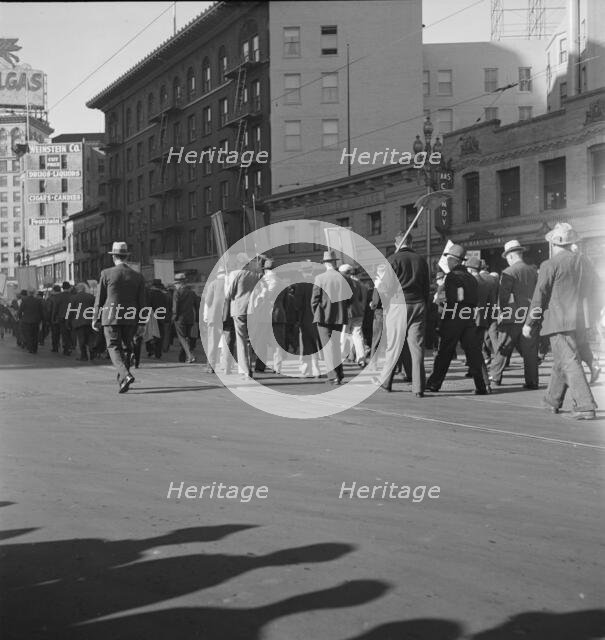 Mass meeting of WPA workers parading up Market Street, San Francisco, California , 1939. Creator: Dorothea Lange.