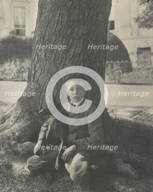 Kermit Roosevelt and his dog Jack, 1902. Creator: Frances Benjamin Johnston.