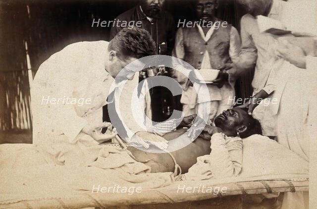 Man being injected by doctor, during the outbreak of bubonic plague in Karachi, India, 1897. Creator: Unknown.