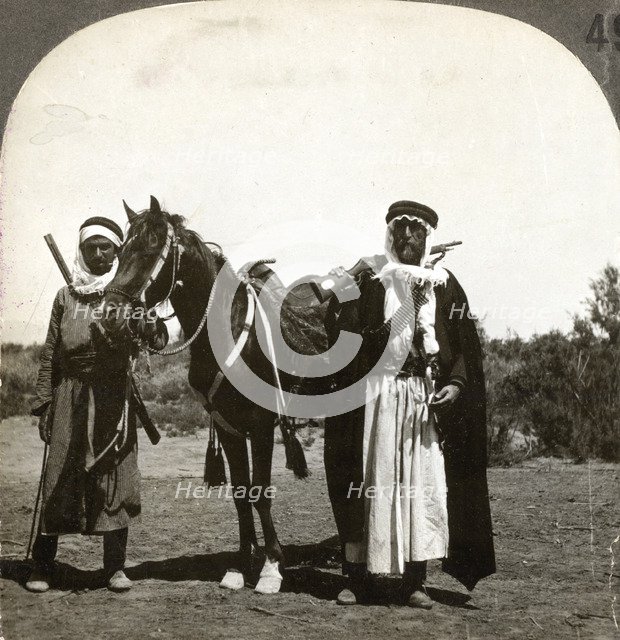 A sheikh and his bodyguard, Syria, 1900s.Artist: Keystone