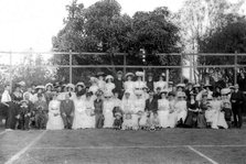 Possibly City Electric Light company employees and their families on a tennis court, 1903. Creator: Robert Augustus Henry L'Estrange.