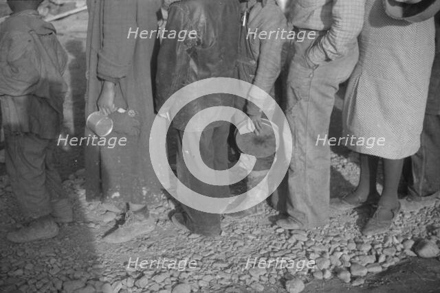Possibly: Negroes in the lineup for food at mealtime in the camp..., Forrest City, Arkansas, 1937. Creator: Walker Evans.