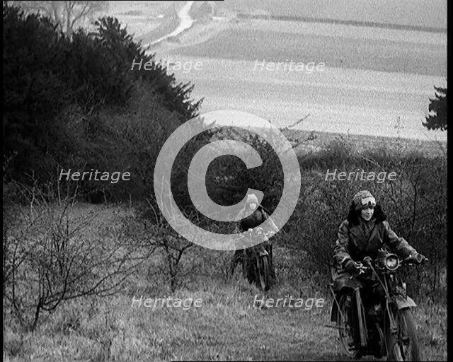 Female Civilians Riding Motorcycles on an Uphill Climb, 1931. Creator: British Pathe Ltd.