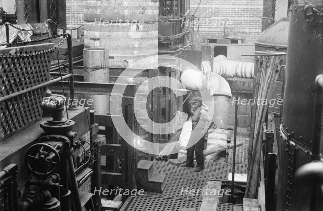 Navy Yard, U.S., Washington - 14 Inch Gun; Various Operations in Shrinking Jacket On It, 1917. Creator: Harris & Ewing.