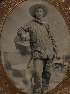 Workman Holding Brush and Rectangular Tray, Arm Resting on Fake Rock, 1860s-80s. Creator: Unknown.