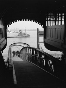 Men walking up a wooden bridge on a river, c1945-c1965.  Artist: SW Rawlings