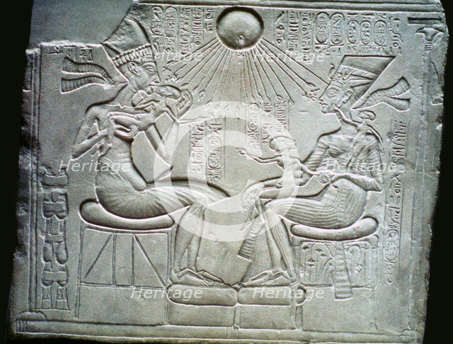 Egyptian relief of Akhenaten and Nefertiti holding their daughters, 14th century BC. Artist: Unknown