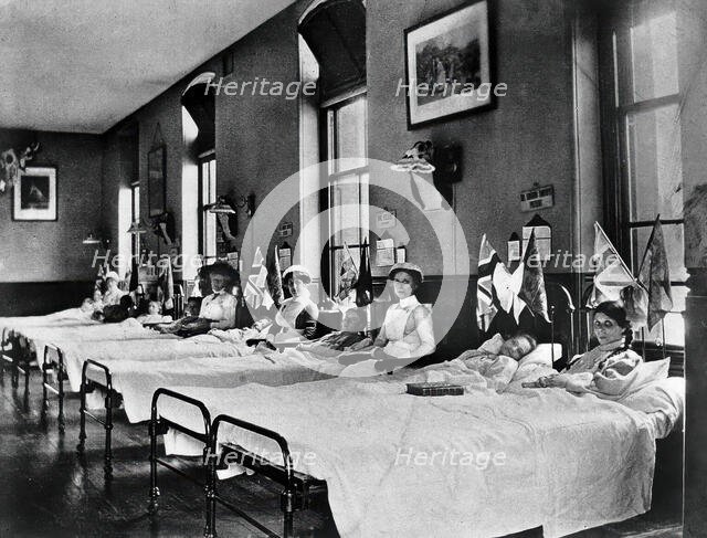 Hahnemann Hospital and Homeopathic Dispensaries, Liverpool: a women's ward, decorated..., [1910?]. Creator: Unknown.