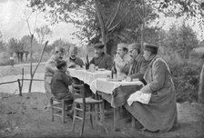 'Alexandre de Serbie au front de Monastir; Le prince Alexandre a fait asseoir a sa table,dresse en p Creator: Vladimir Betzitch.