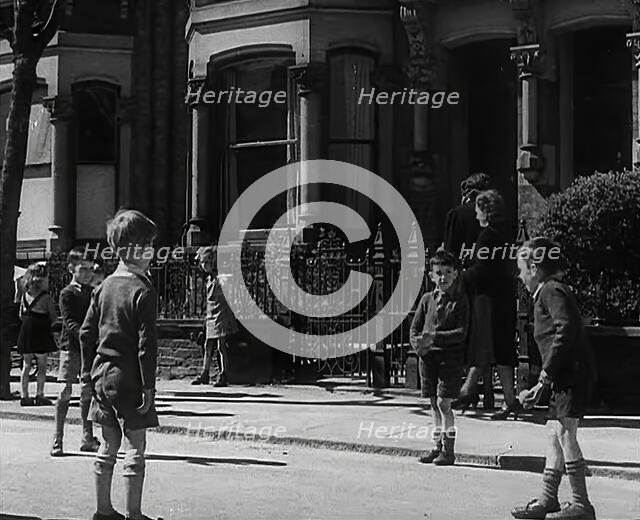Children Playing in the Street, 1942. Creator: British Pathe Ltd.