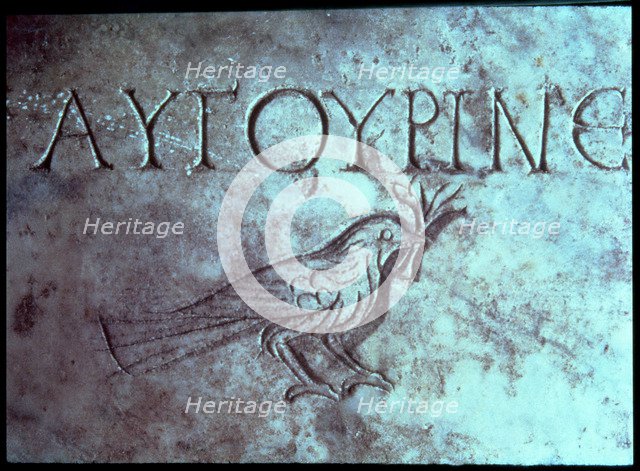 Gravestone with the figure of a dove or a sparrow in the Catacombs of San Calixtus.