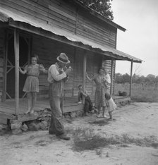 Tobacco sharecropper ready to return to the field, Person County, North Carolina, 1939. Creator: Dorothea Lange.