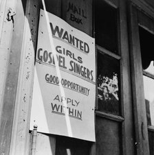 A sign in the Harlem section, New York, 1943. Creator: Gordon Parks.