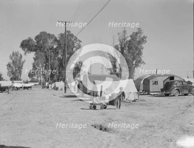 Migratory labor housing during carrot harvest, near Holtville, Imperial Valley, California , 1939. Creator: Dorothea Lange.