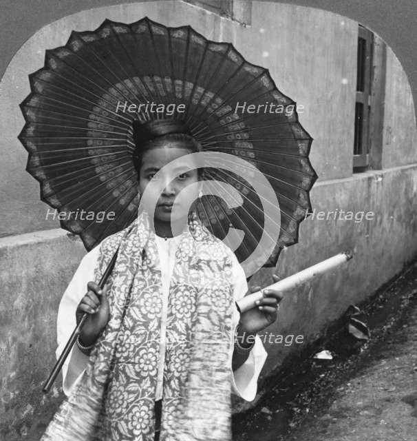 Young Burmese woman holding a huge cigar, Rangoon, Burma, 1908. Artist: Stereo Travel Co