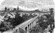 Railway line from Vitré to Fougères. Pass of a steam train by the viaduct on the Vilaine near Vit…