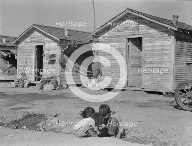 Company housing for cotton workers near Corcoran, California, 1936. Creator: Dorothea Lange.