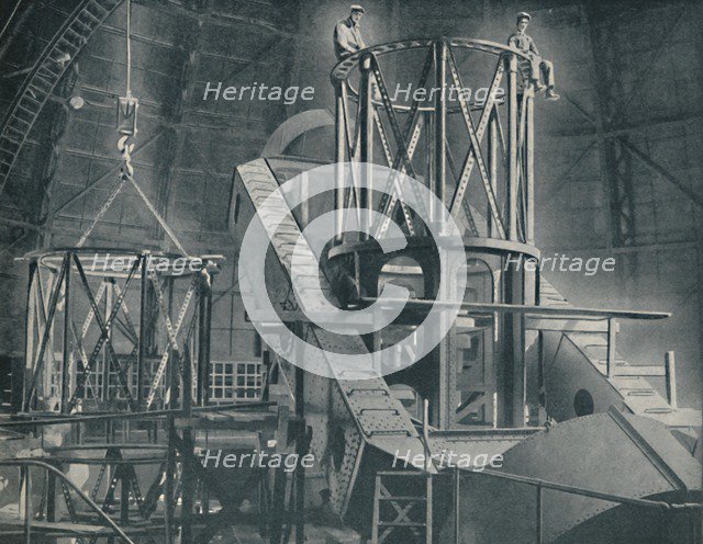 'Section By Section Mounts The Huge Steel Framework of the Hooker's Cylinder', c1935. Artist: Unknown.