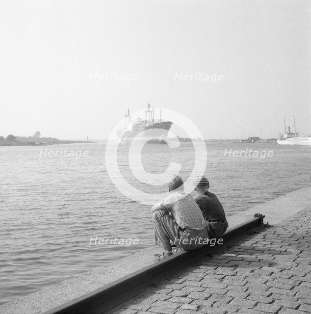 Two boys watching shipping in the harbour of Landskrona, Sweden, 1956. Artist: Unknown