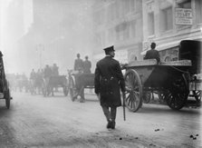 Police protecting garbage carts, 1911. Creator: Bain News Service.
