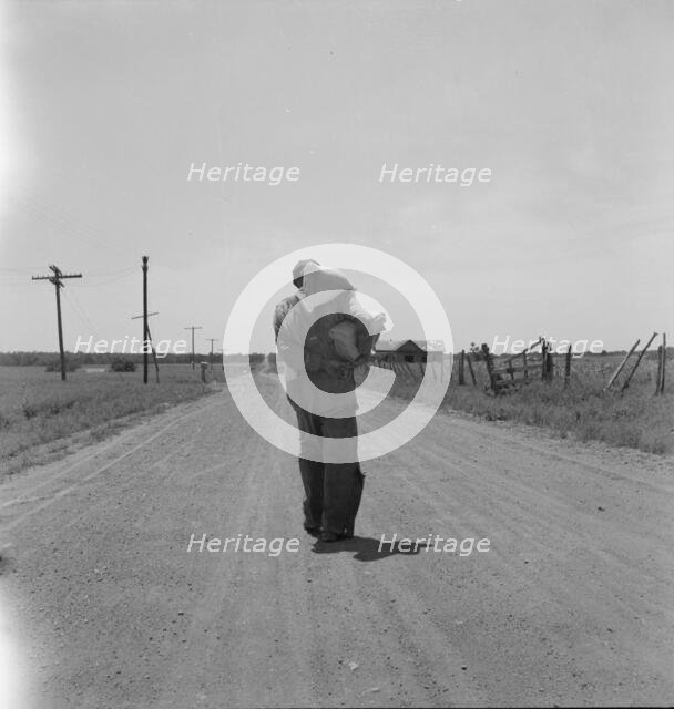 Man going home with relief, near Oil City, Carter County, Oklahoma, 1937. Creator: Dorothea Lange.
