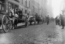 Garbage carts protected by police, 1911. Creator: Bain News Service.