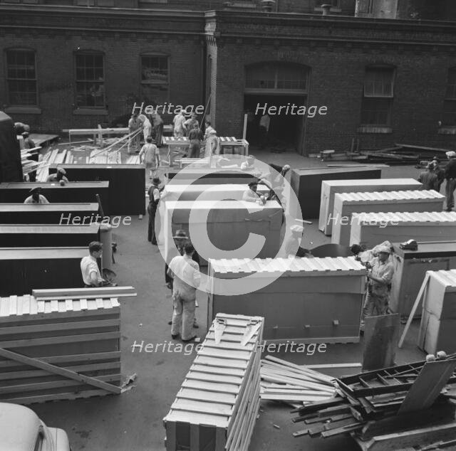 Possibly: United States government workers and carpenters making crates..., Washington, D.C., 1942. Creator: Gordon Parks.