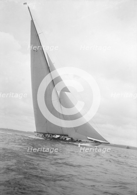 The 23-metre cutter 'Astra' sailing close-hauled, 1932. Creator: Kirk & Sons of Cowes.