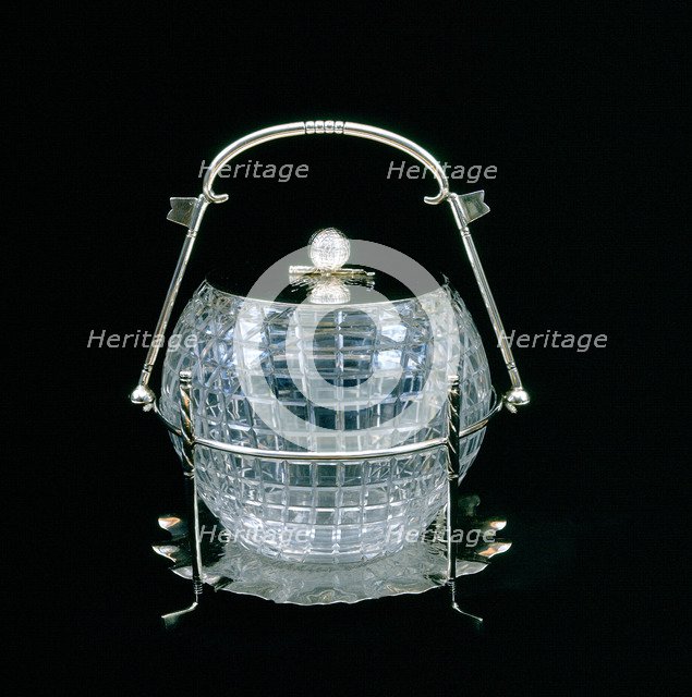 American glass biscuit barrel cut in the shape of a mesh patterned golf ball, 1910. Artist: Unknown