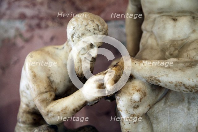 Pan and satyr, Pan removing a splinter from a satyr's foot. Artist: Unknown