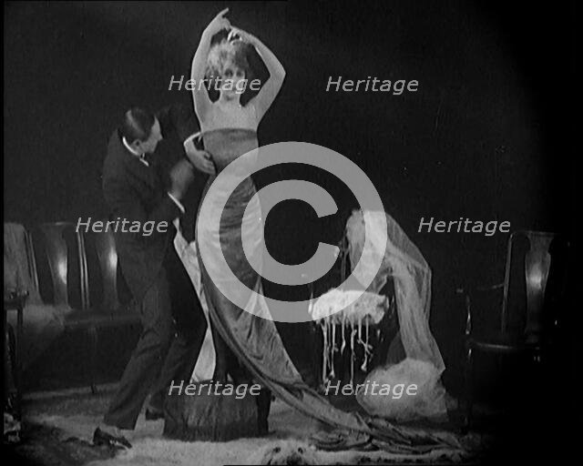 Alphonse Berge, Famous Fashion Designer,  Constructing a Dress, a Female Civilian Model..., 1920. Creator: British Pathe Ltd.
