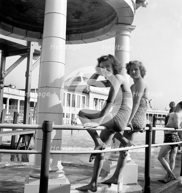 Two bathing beauties pose for the camera in the Blackpool Lido, c1946-c1955. Artist: John Gay