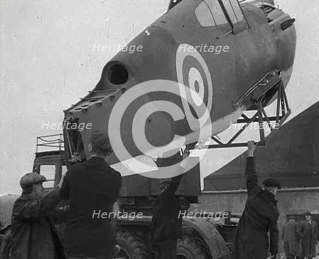 An American Aircraft Part Being Carried by a Crane to Be Sent by the USA to Britain, 1941. Creator: British Pathe Ltd.