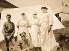 Ethel Newland and fellow nurses and military, c1918. Creator: Unknown.