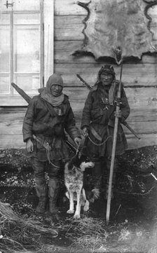 Two Chukchi in national clothes, with guns and a spear, 1910-1929. Creator: Ivan Emelianovich Larin.
