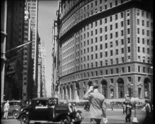 The Crowds Moving Around on a New York City Street, 1930s. Creator: British Pathe Ltd.